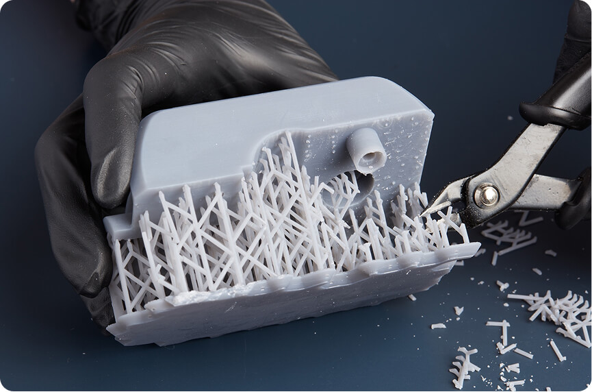 3D printed part with support structures before removal