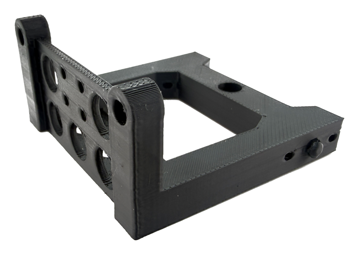 Black 3D printed mounting bracket with lightening holes, produced at Simple Machining