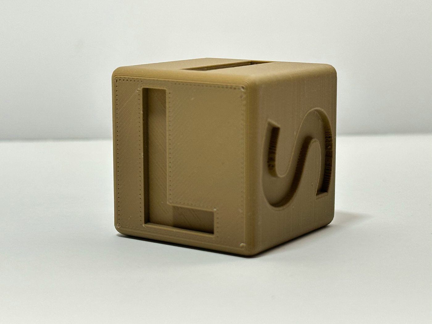 FDM 3D printed calibration cube in PLA showing layer quality and dimensional accuracy