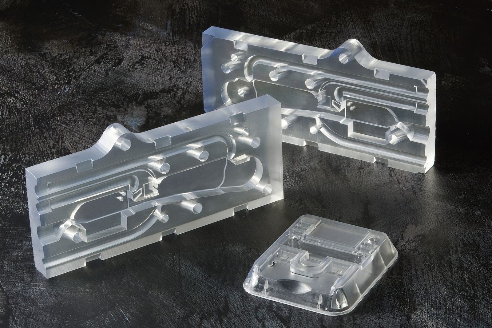 Transparent SLA 3D printed parts in Clear Resin showing optical clarity