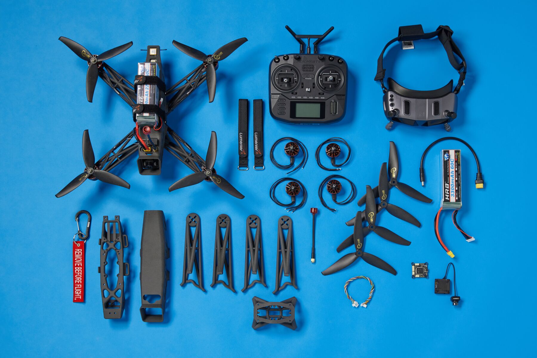 SLS 3D printed drone components laid out showing complex lattice frames, arms, and structural parts